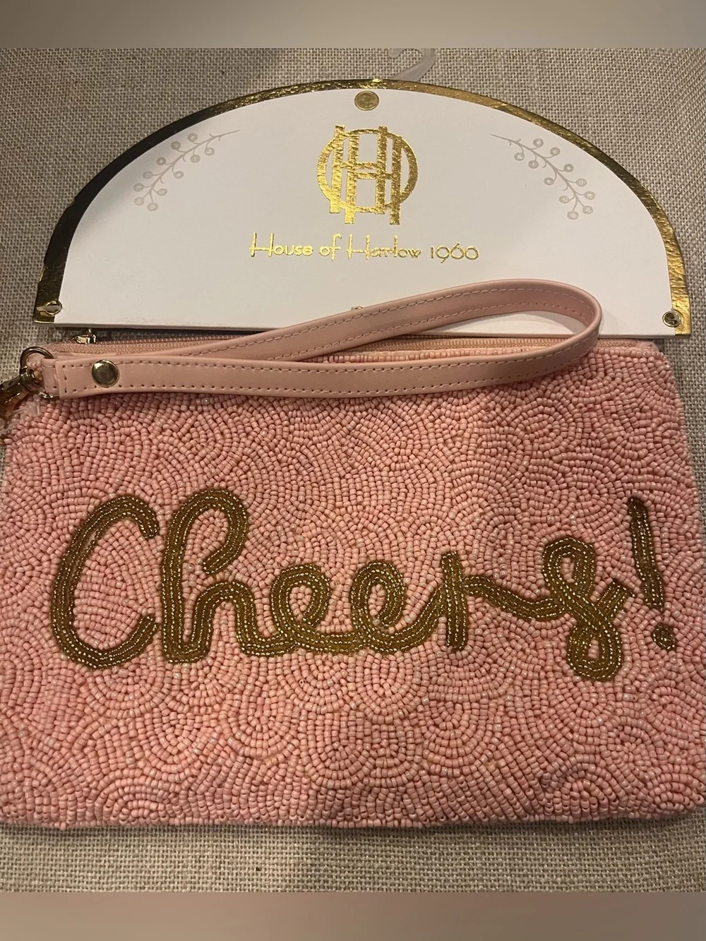 NWT House of Harlow 1960 Pink Beaded 'Cheers!' Wristlet Clutch with Gold Script